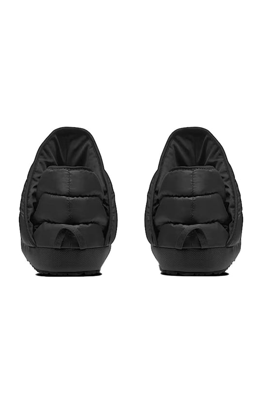 Two black slippers on a white background