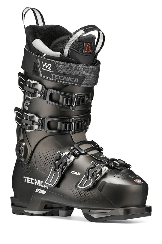 Black ski boot with green accents on a white background