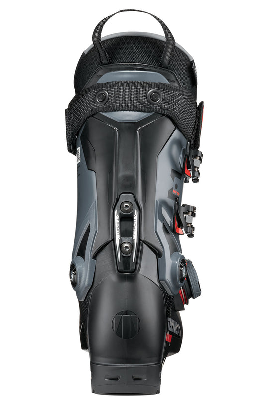 Black ski boot with visible branding on a white background