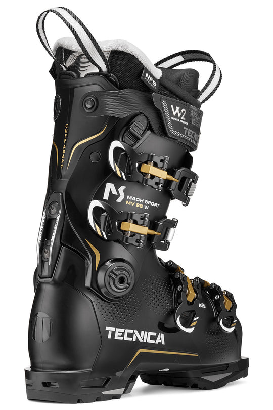 Black Tecnica ski boot with gold accents on a white background