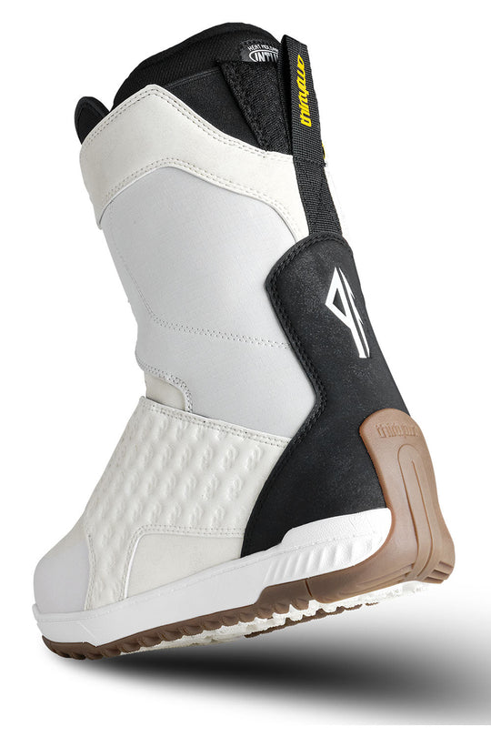White and black boot with brown sole on a white background