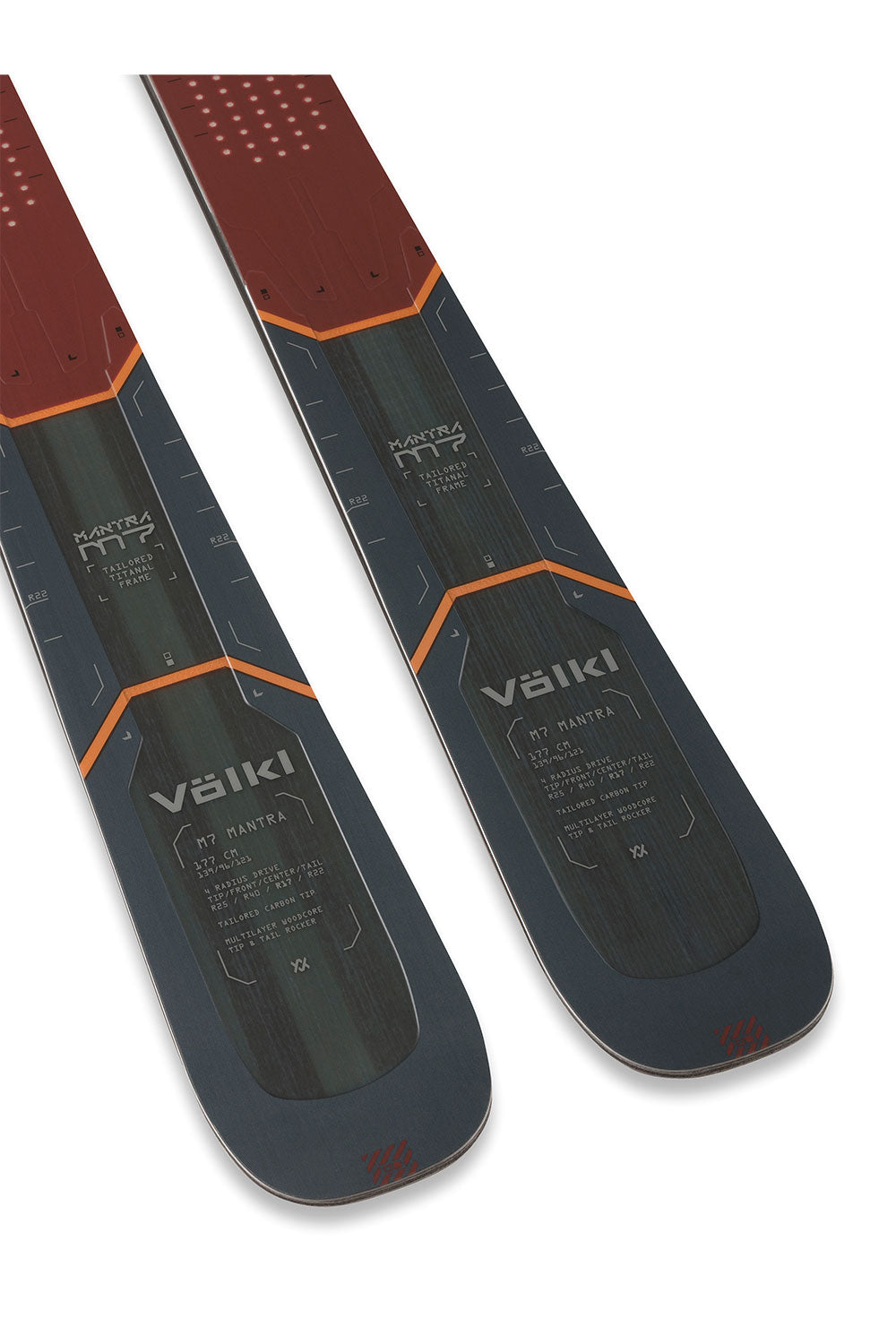 Two skis with red and black design on a white background