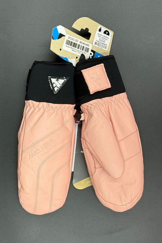 Pair of pink mittens with black cuffs on a gray background