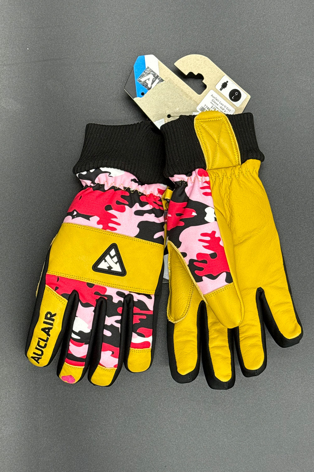 Pair of colorful gloves with a brand logo on a gray background