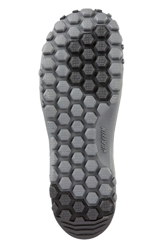 Close-up of a gray and black sole with hexagonal pattern on a white background