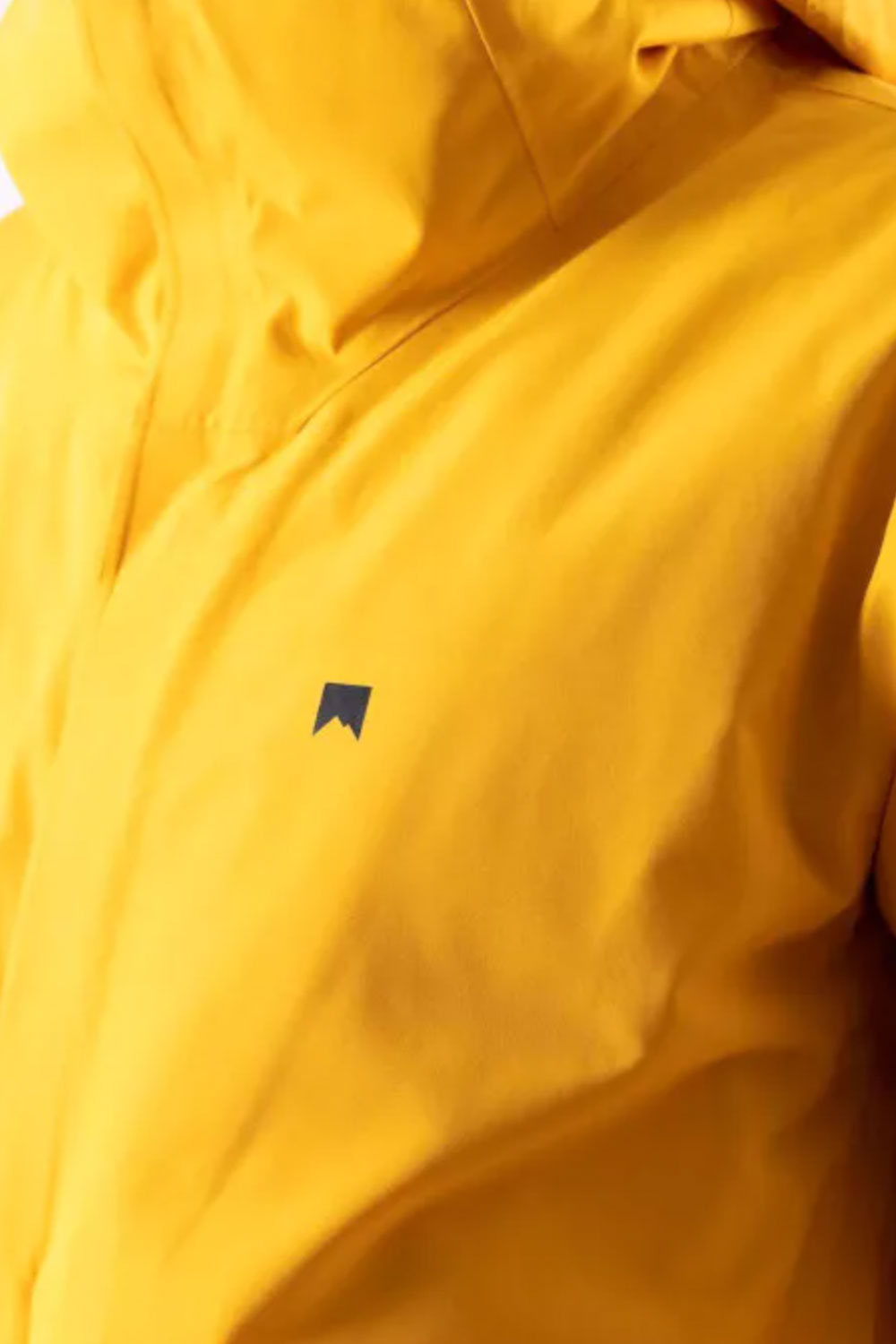 Close-up of a yellow jacket with a small logo on the chest.
