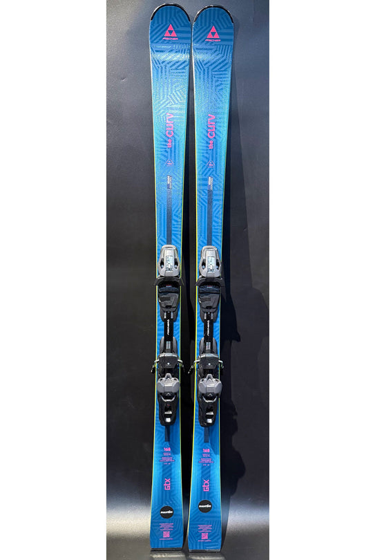 Pair of blue skis with bindings on a dark background