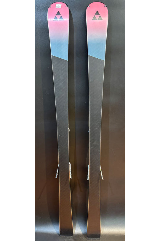 Two skis with a gradient design on a reflective surface