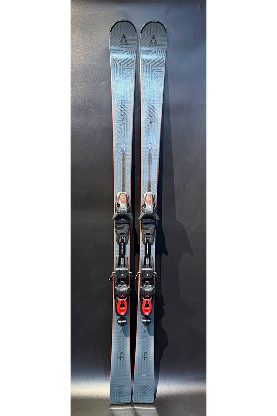 Pair of skis with bindings on a reflective surface
