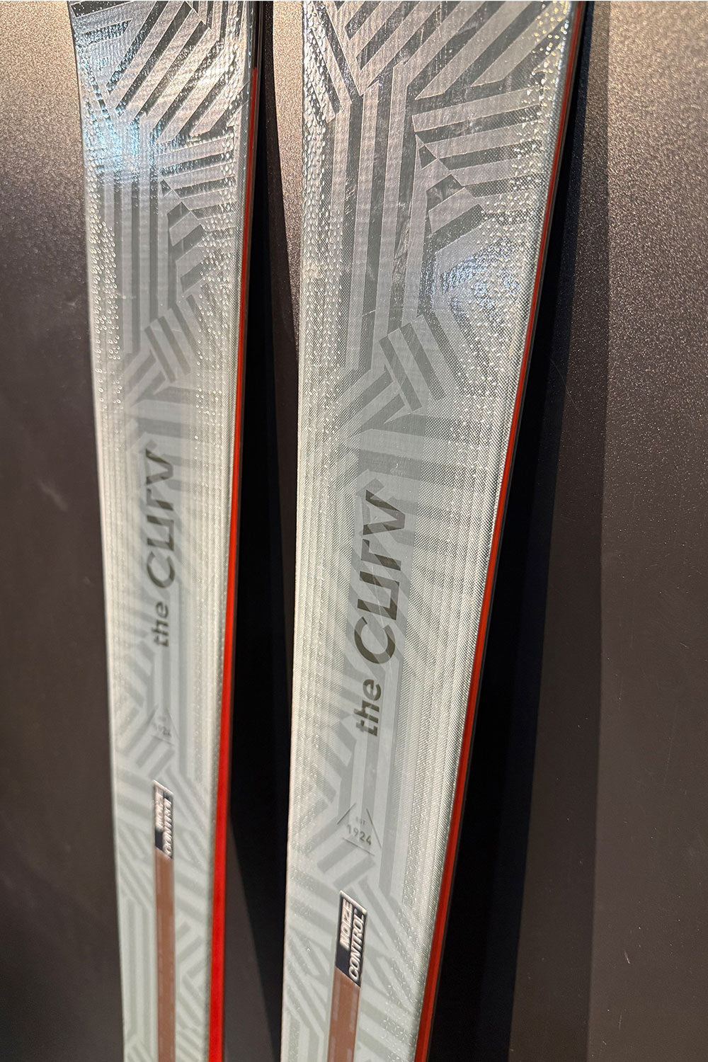 Two skis with 'the Clifv' branding on a dark background