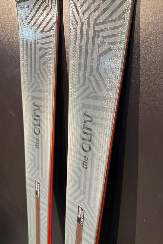 Two skis with 'the Clifv' branding on a dark background