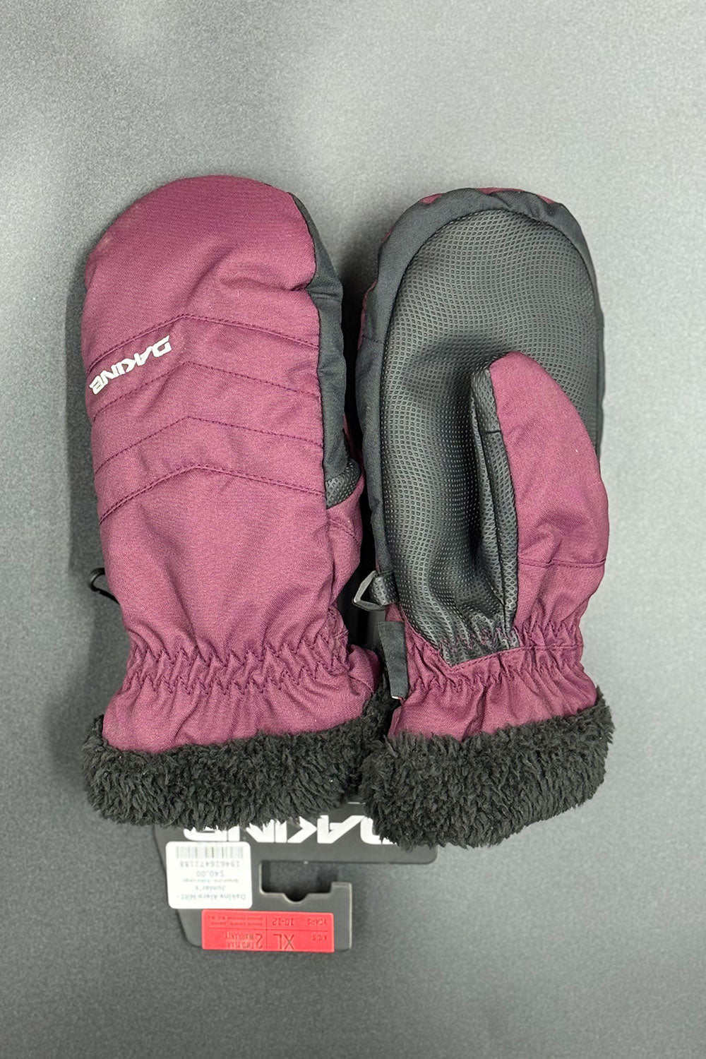 Pair of purple and black mittens on a gray background