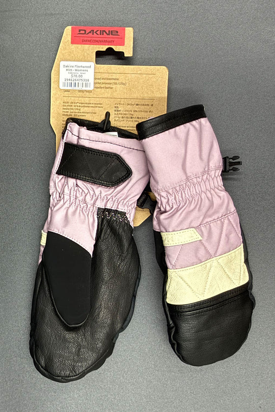 Pair of pink and black mittens with a Dakine tag on a gray background