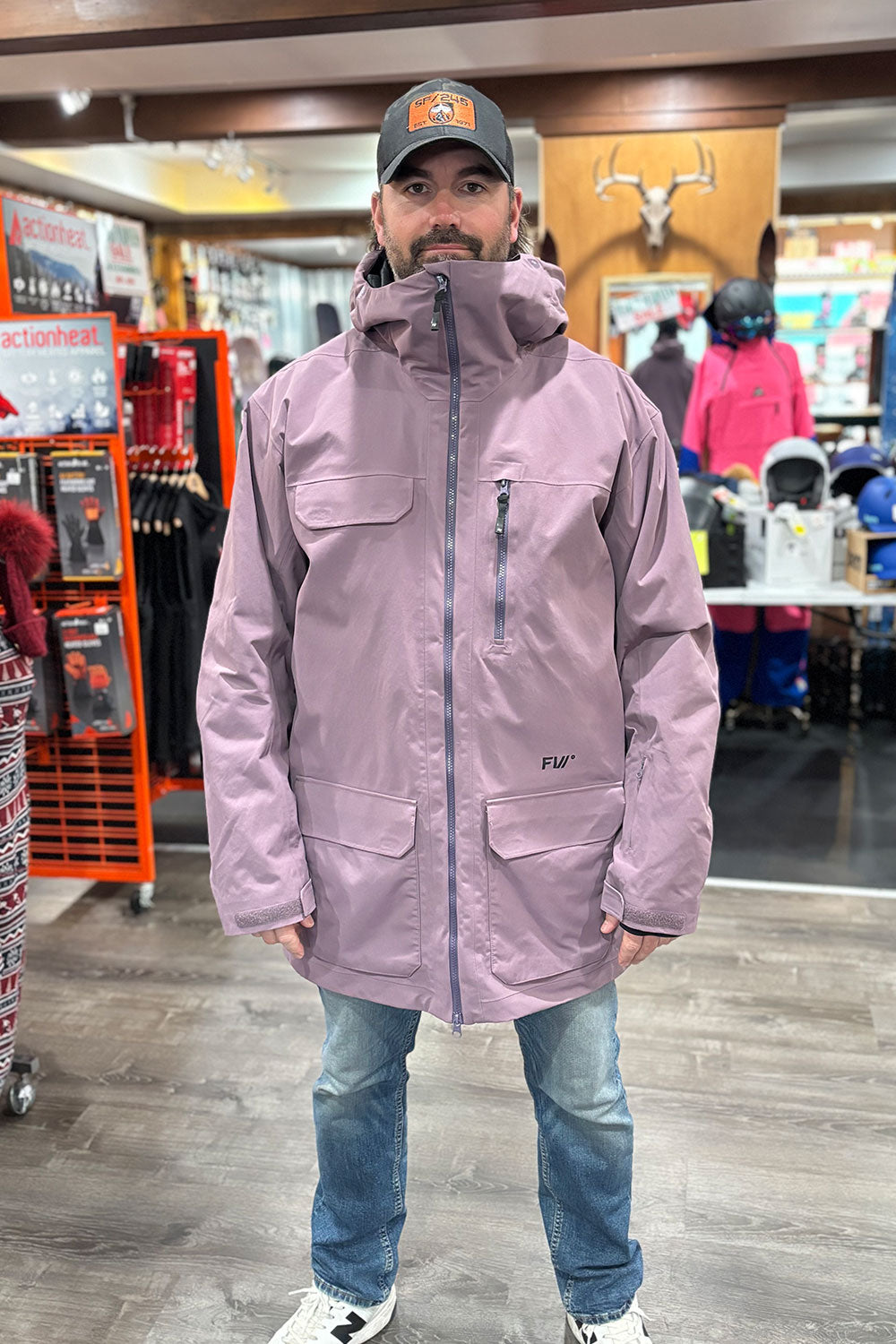 man wearing a long purple ski coat