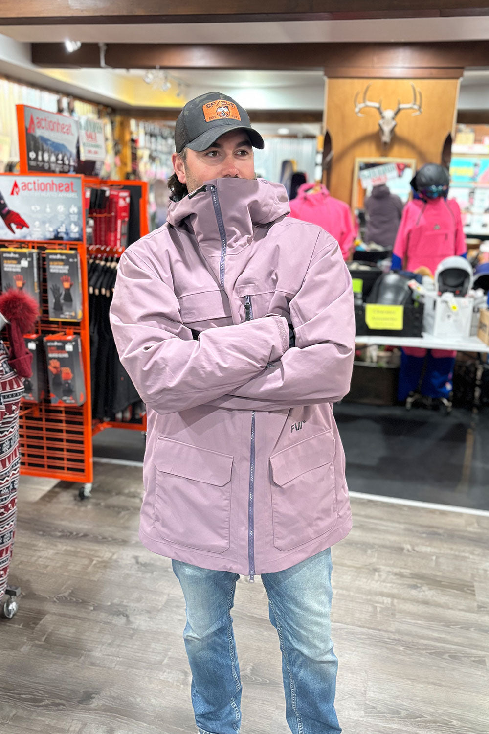 man wearing a long purple ski coat