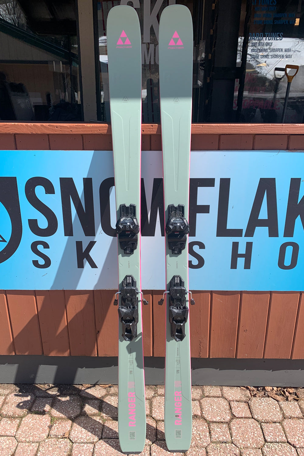 Fischer Ranger 90 demo skis, mint green with pink accents with black demo bindings