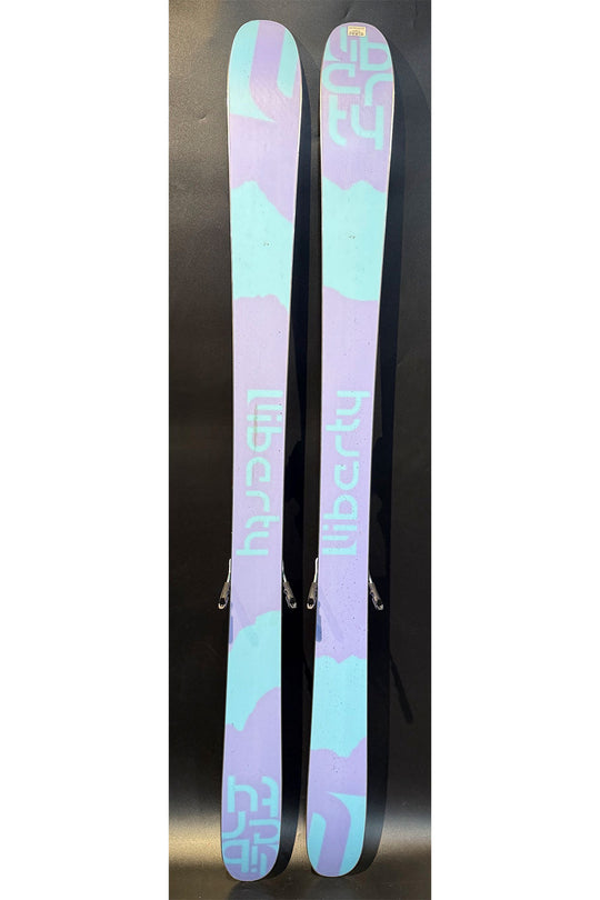 Pair of skis with a colorful design on a black background