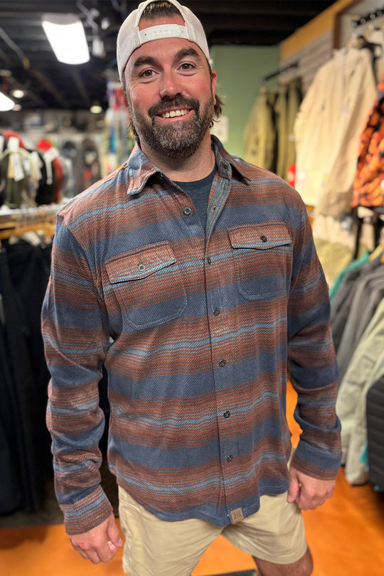 person wearing a striped flannel shirt