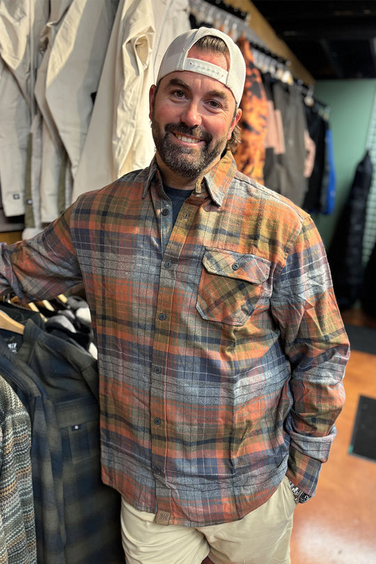 person wearing a flannel shirt