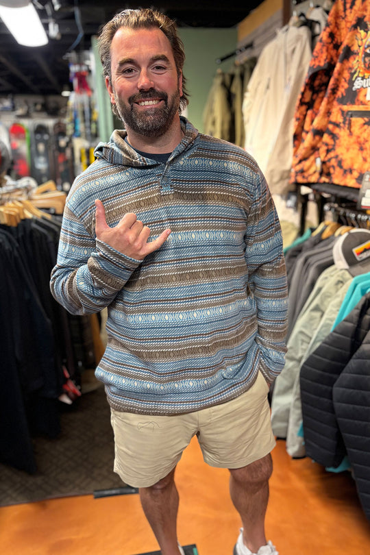 person wearing a striped fleece hooded  shirt