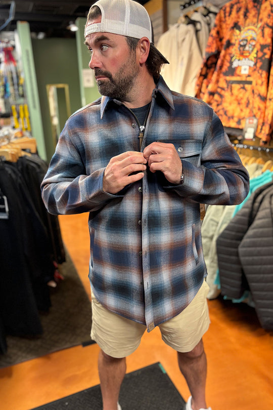 person wearing a flannel jacket