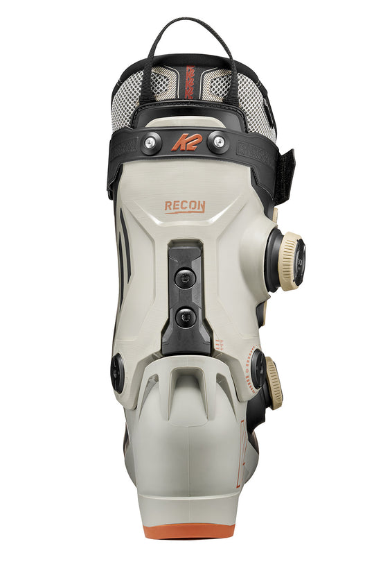 White ski boot with black and orange accents on a white background