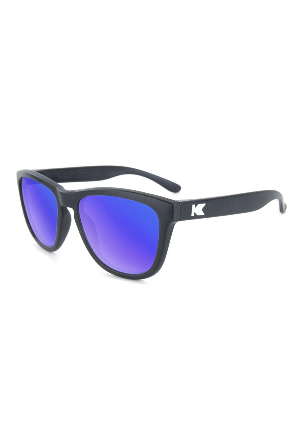 Black sunglasses with purple lenses on a white background