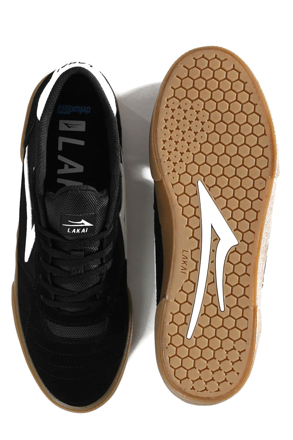 Black sneaker with white sole on a white background