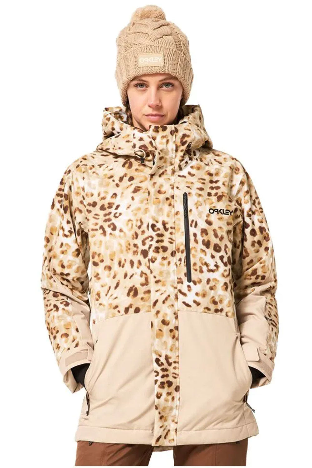 Person wearing a leopard print and beige snow jacket with a beanie on a white background