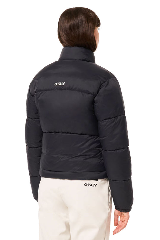 Person wearing a black puffer jacket with 'Oakley' branding on a white background