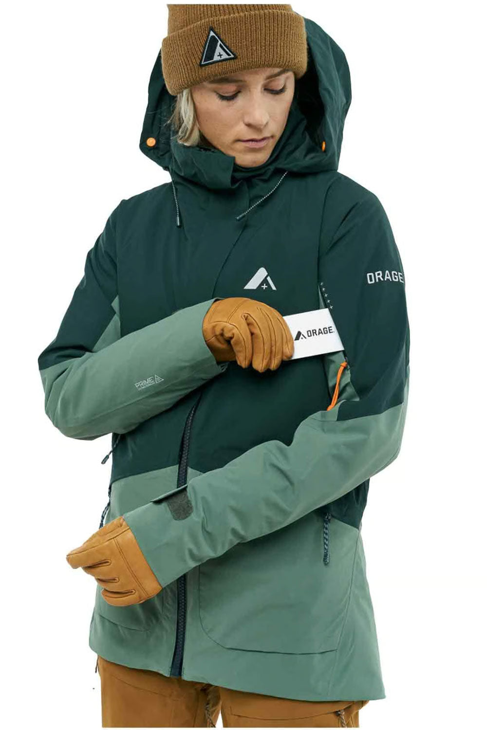 Person wearing a green and gray jacket with a brand logo on a white background