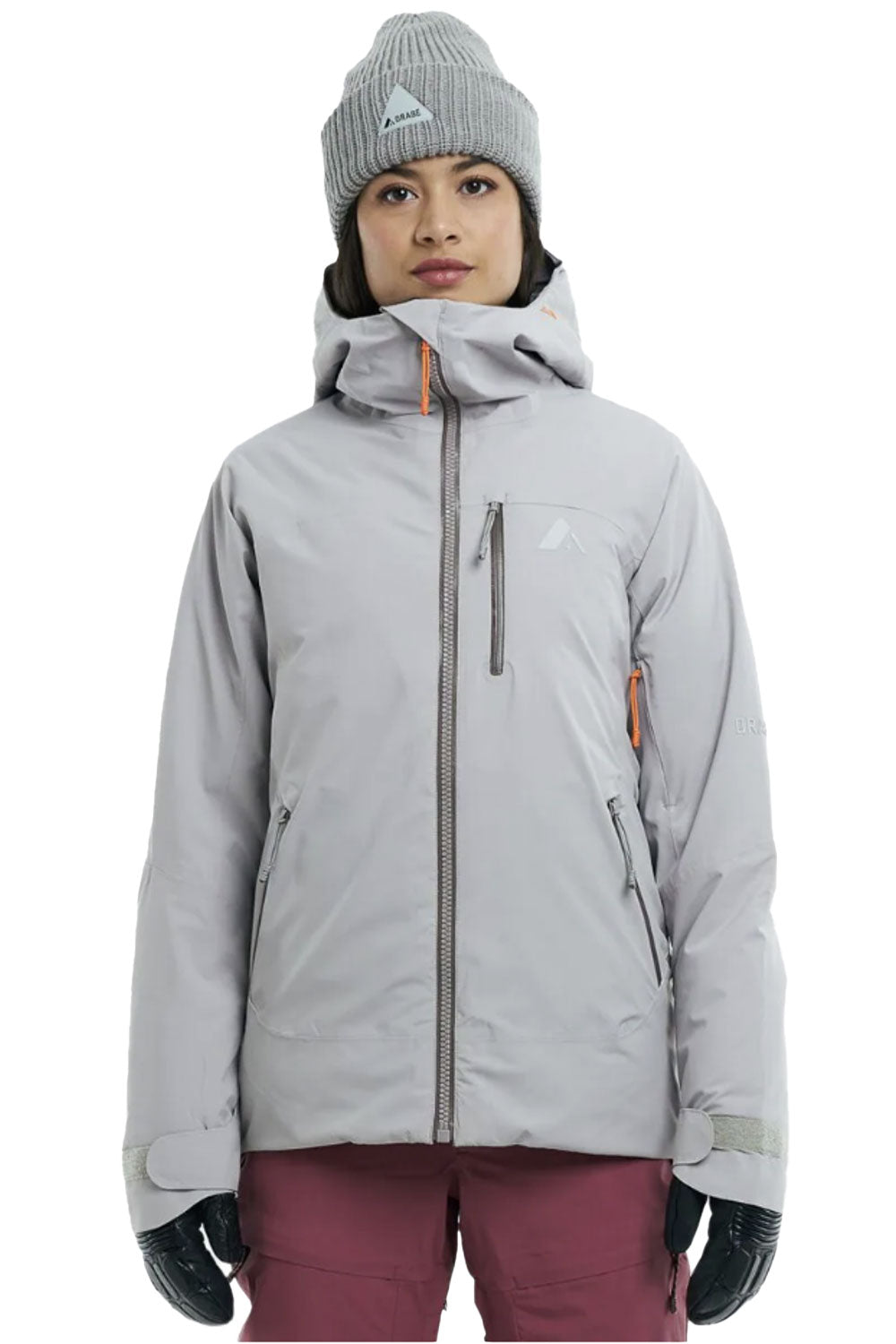 Person wearing a gray jacket, beanie, and gloves on a white background
