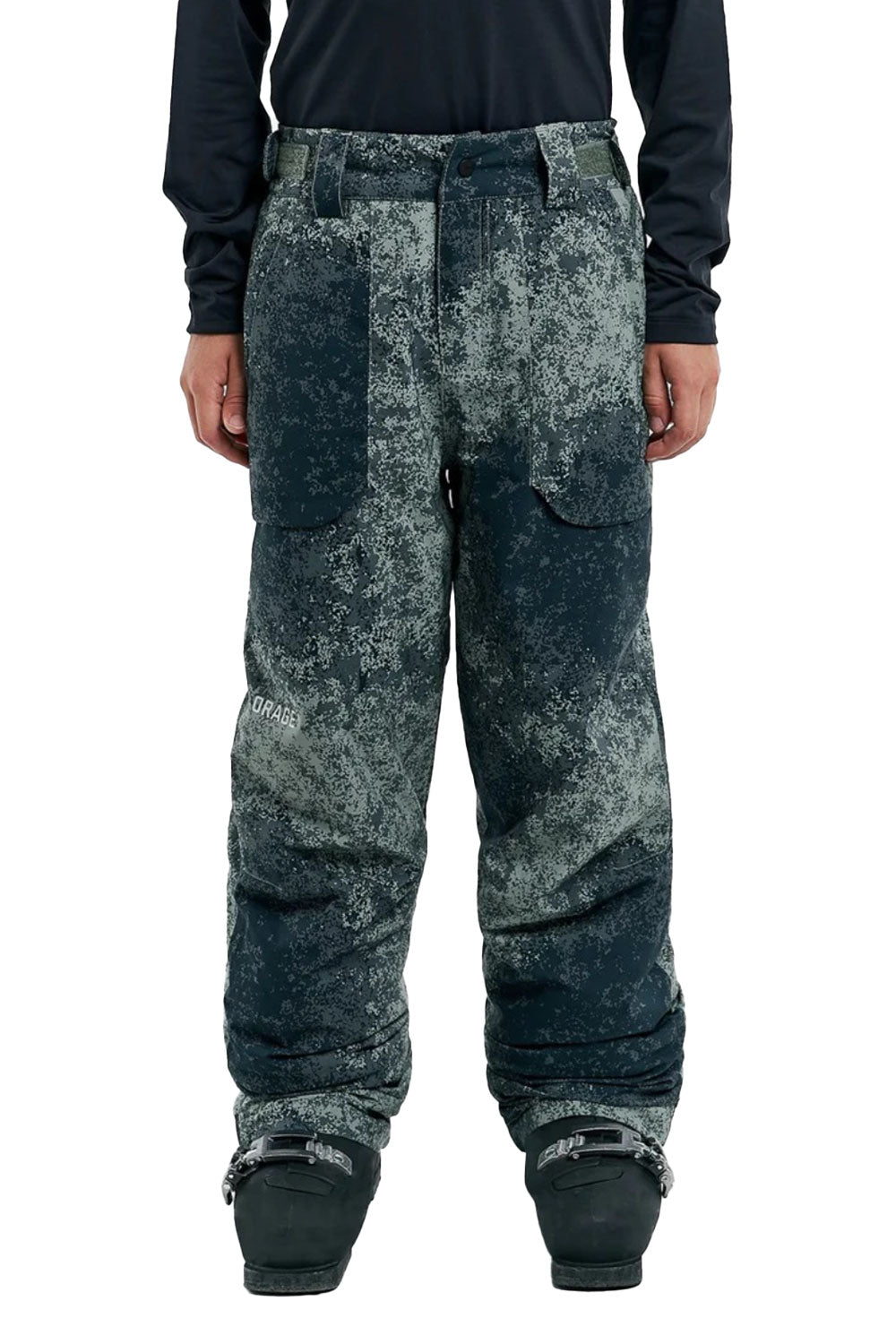 Camouflage snow pants worn by a person on a white background