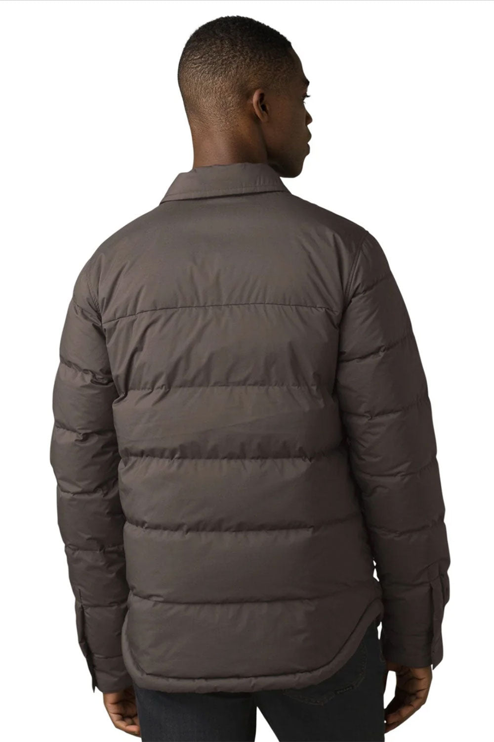 Man wearing a brown puffer jacket on a white background