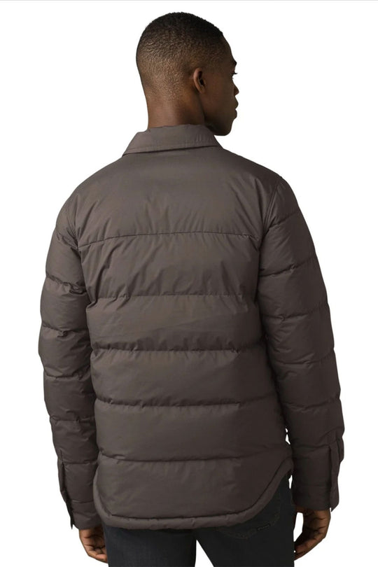 Man wearing a brown puffer jacket on a white background