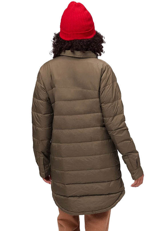 Person wearing a long brown puffer coat and red beanie on a white background