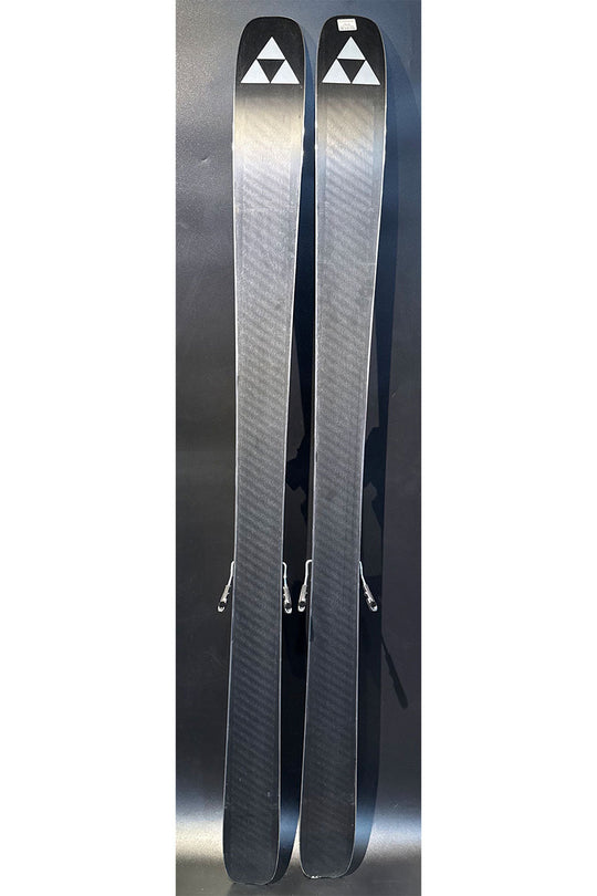 Two skis with a brand logo on a reflective surface