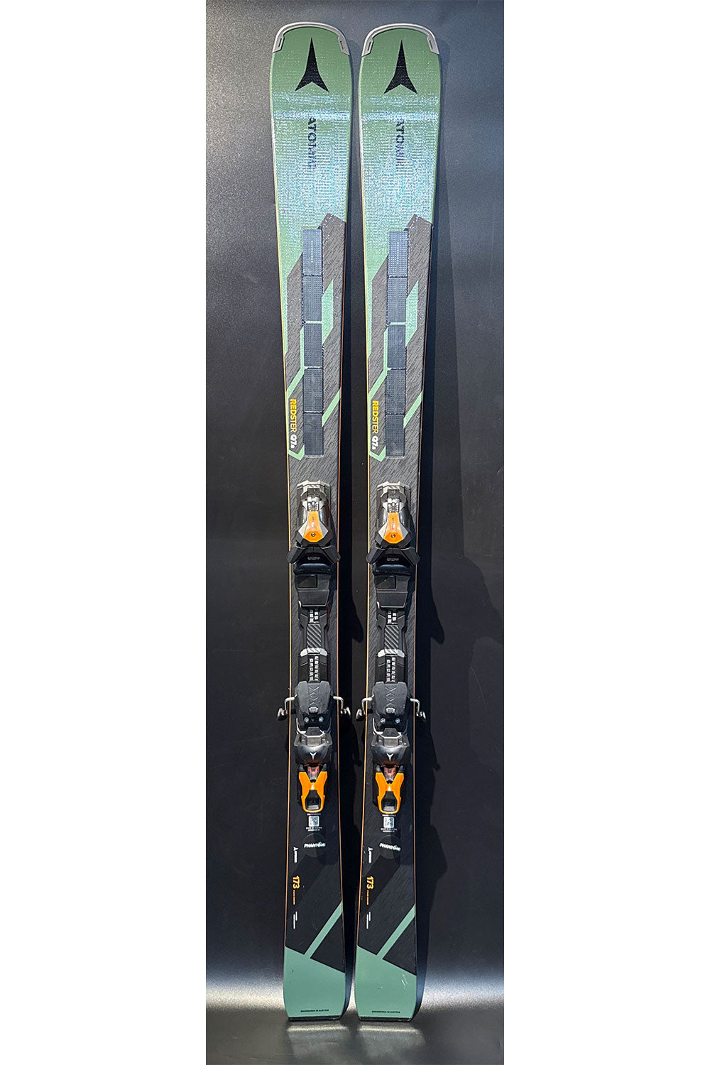 Pair of skis with bindings on a dark background