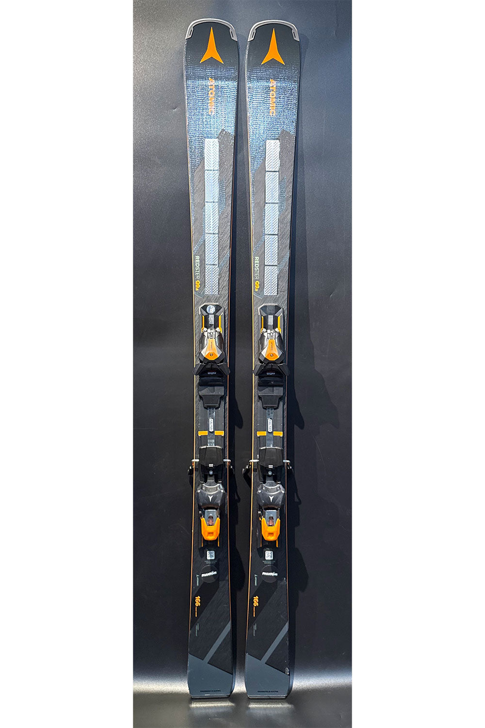 Pair of skis with bindings on a dark background