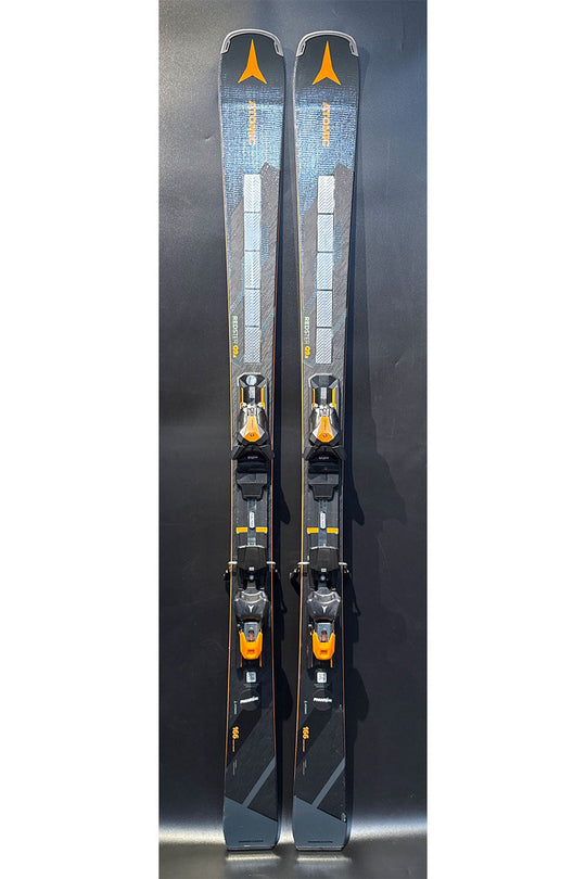 Two skis with bindings on a black background