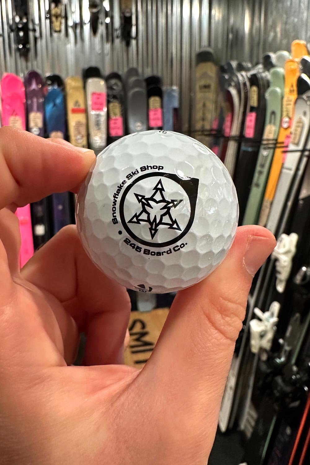 golf balls with Snowflake Ski Shop logo