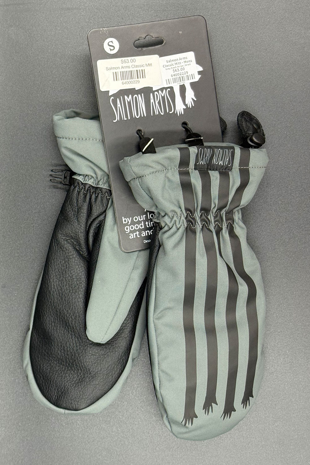 Pair of green and gray mittens with branding on a gray background