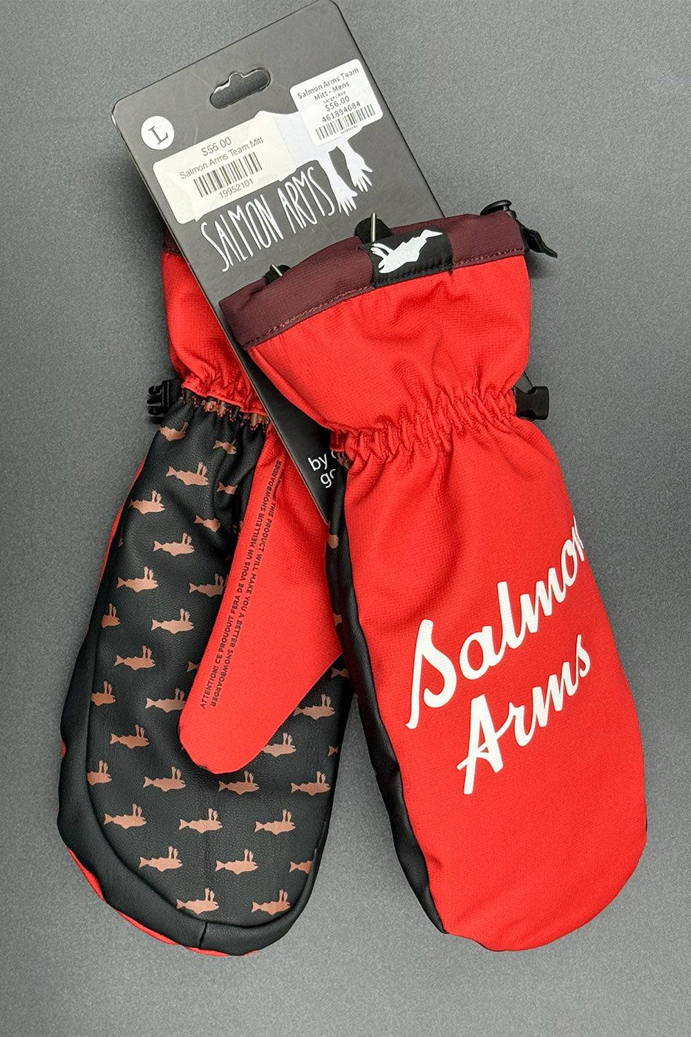 Red and black mittens with 'Salmon Arms' branding on a gray background