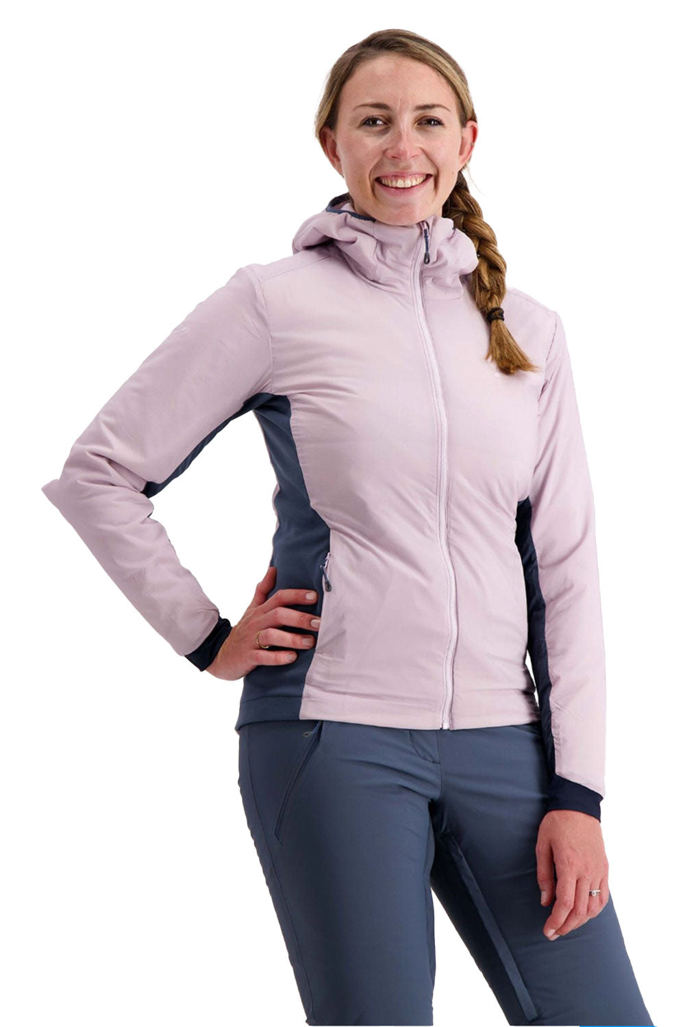 Woman wearing a light pink and blue jacket on a white background