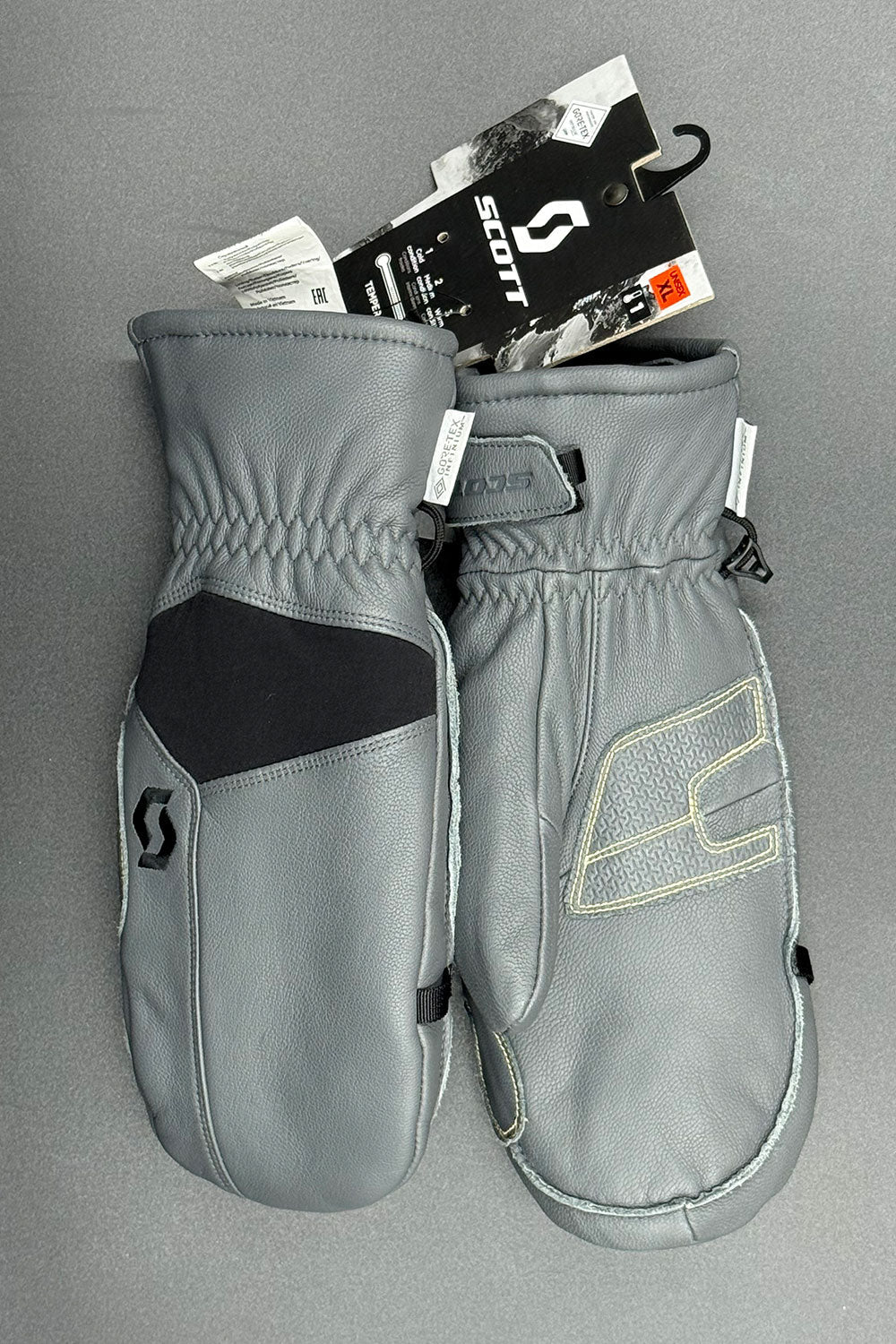 Gray mittens with Scott logo on a gray background