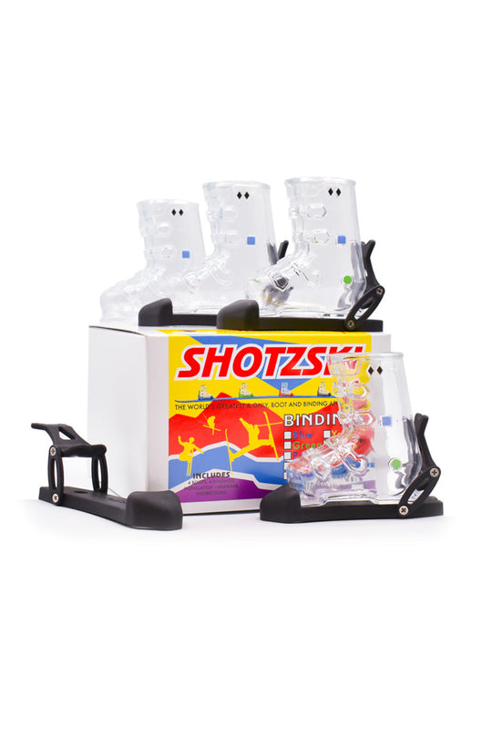 Shotzki ski binding packaging with bindings and accessories on a white background