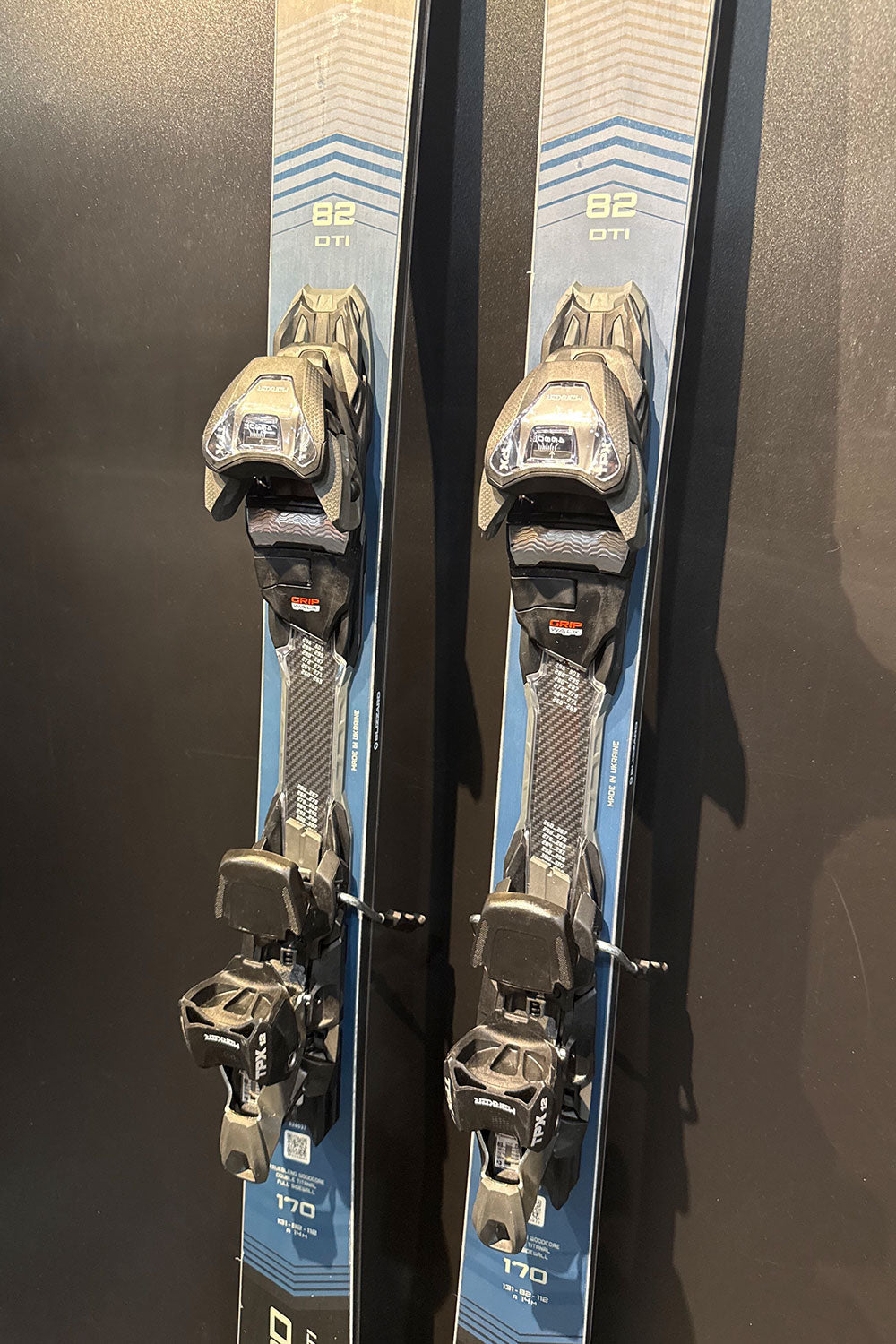 Pair of skis with bindings on a dark background