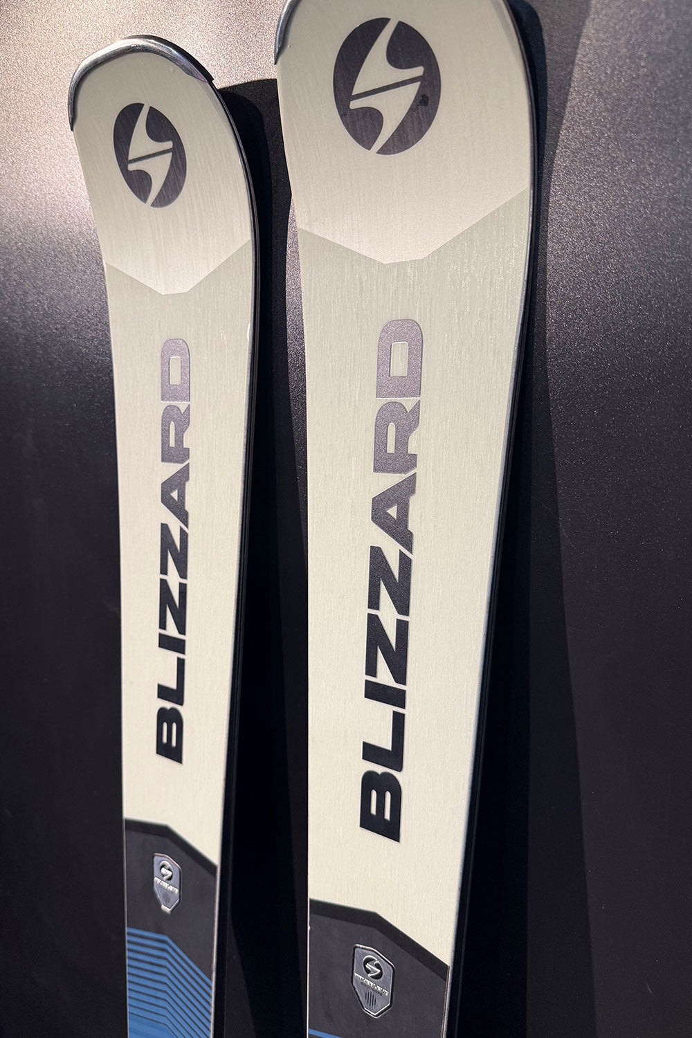 Two Blizzard skis on a black background