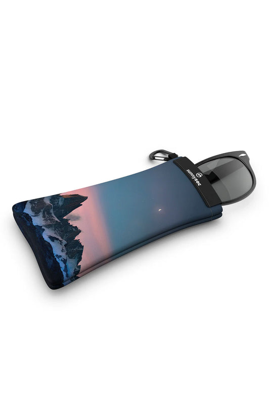 Sunglasses with a case featuring a scenic design on a white background
