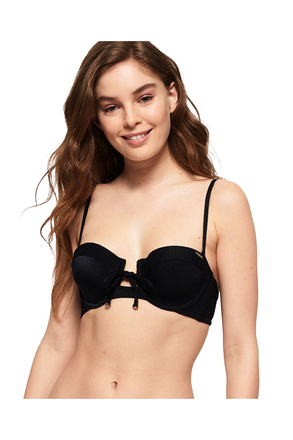 Woman wearing a black bikini top on a white background
